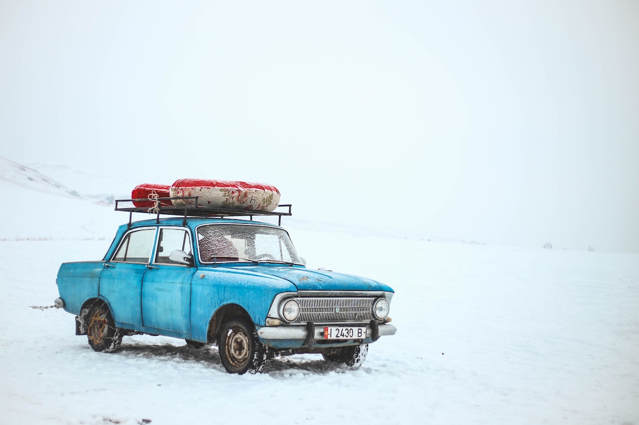 Photo of an old car in snow